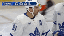 a hockey player with the number 91 on his shirt