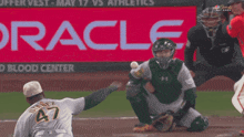 a baseball player with the number 4 on the back of his shirt