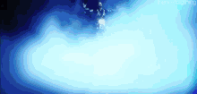 a man is standing in a cloud of blue smoke in a dark room .