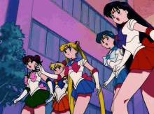 a group of anime girls standing next to each other