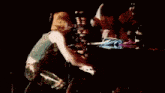 a woman is playing a piano that says steinway on it