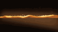 a close up of a wave of potato chips on a black background
