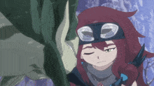 a girl with red hair and a headband with the letter c on it looks down at something