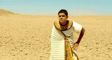 a man standing in the desert with the words ca va etre tres bien meme written below him