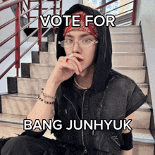 a man wearing glasses and a bandana is sitting on a set of stairs and says vote for bang junhyuk