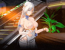 a woman in a white dress stands in front of a plant