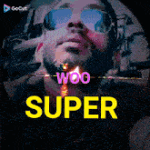 a man with a beard wearing sunglasses and headphones with the word super above him