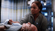 Fixing Patients Arm Will Halstead GIF - Fixing Patients Arm Will Halstead Maggie Lockwood GIFs