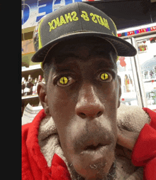 a man wearing a hat that says " xmah2 & 2tah " on it