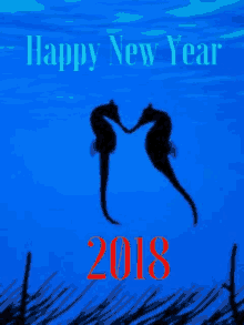 a happy new year card with two seahorses