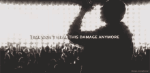 a silhouette of a man holding a microphone with the words time won 't heal this damage anymore
