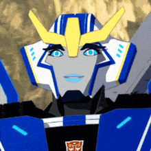 a blue and white robot with a yellow helmet and blue eyes