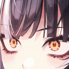 a close up of a girl 's eyes with a circle in the center