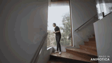 a woman is walking down a set of stairs made in animotica