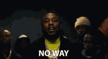 a man wearing a neon green turtleneck and a black jacket says no way
