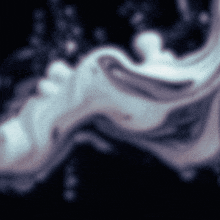 a blurred image of a person 's face with a purple background