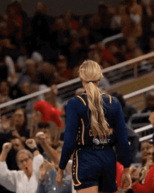 a woman wearing a jersey that says at & t