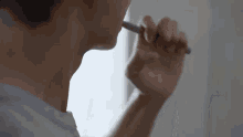 a close up of a person brushing their teeth with a toothbrush