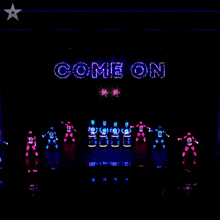 the word come on is displayed on the stage