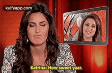 a woman is talking to another woman on a television screen .