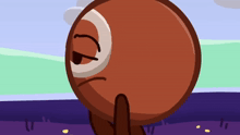 a cartoon drawing of a brown ball with a white circle on its face
