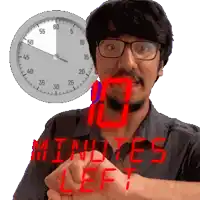 a man with glasses and a clock behind him that says " minutes left "