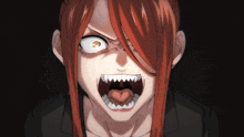 a close up of a woman with red hair making a funny face