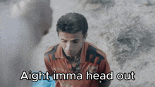 a man in a red shirt with the words aight imma head out below him