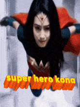 a woman in a superhero costume is flying in the air