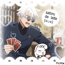 a picture of a man holding playing cards with the words satoru de latte on it