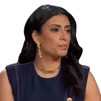 a woman wearing dior earrings and a necklace