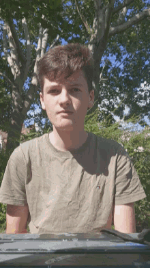 a young man wearing a tommy hilfiger shirt