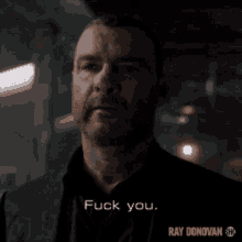 a man in a suit says fuck you