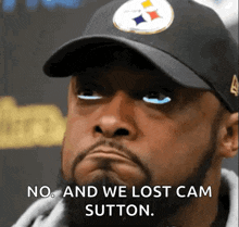 a man with a beard wearing a hat that says " no and we lost cam sutton "
