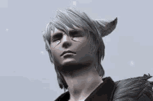 a man with cat ears is wearing a black jacket and looking up .