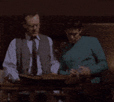 two men looking at a piece of paper with the words we 're going to need a bigger boat below them