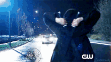 an advertisement for arrow shows a woman standing on a street at night