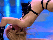 a woman is doing a handstand on a blue background with t4yce tumblr in the lower left corner