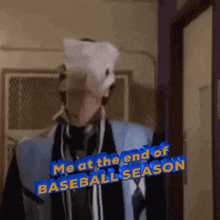 a man with a mask on his face is standing in front of a sign that says me at the end of baseball season