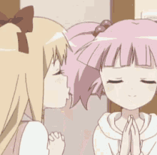 a cartoon drawing of a girl kissing another girl 's cheek