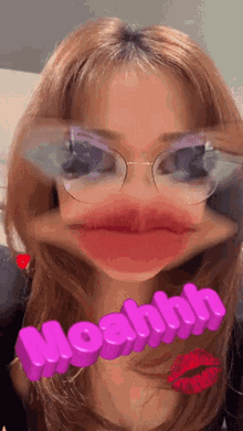 a woman wearing glasses and a pink moahhh sign
