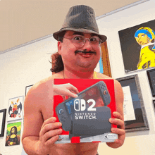 a shirtless man in a hat is holding a nintendo switch box