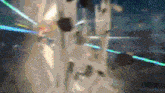a blurred image of a building with a blue light coming out of the top