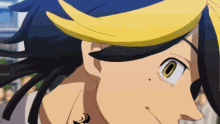 a close up of a person 's face with yellow hair