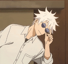 a cartoon character with white hair and sunglasses covering his face