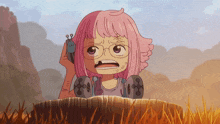 a girl with pink hair and glasses is holding a remote control