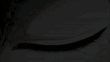 a close up of a person 's eye with a black eyeliner