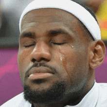 a man with tears running down his face