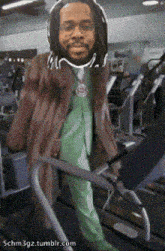 a cartoon of a man walking on a treadmill with the website 5chm3gz.tumblr.com in the corner