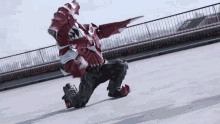 a man in a red and white costume is kneeling down on the ground